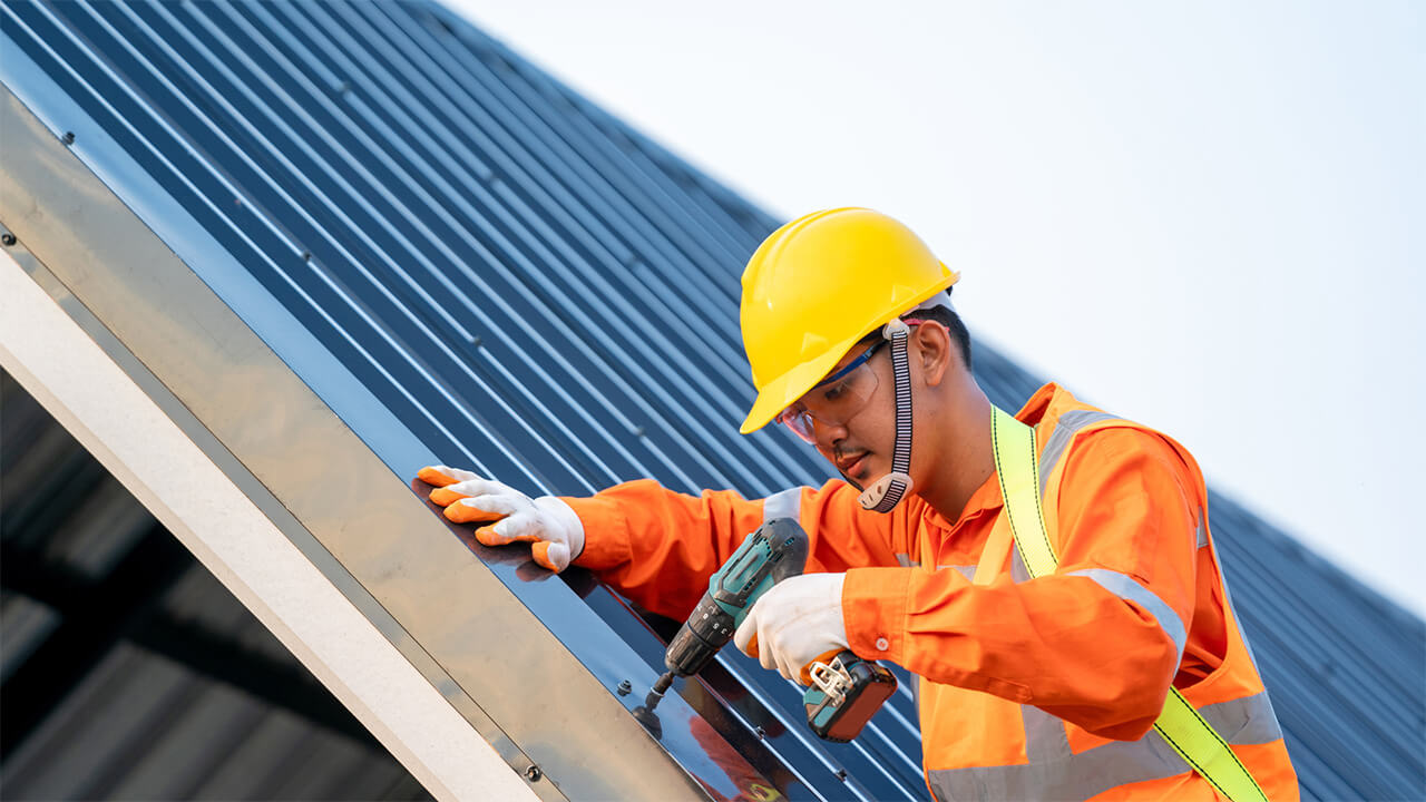 construction-worker-roof-drilling